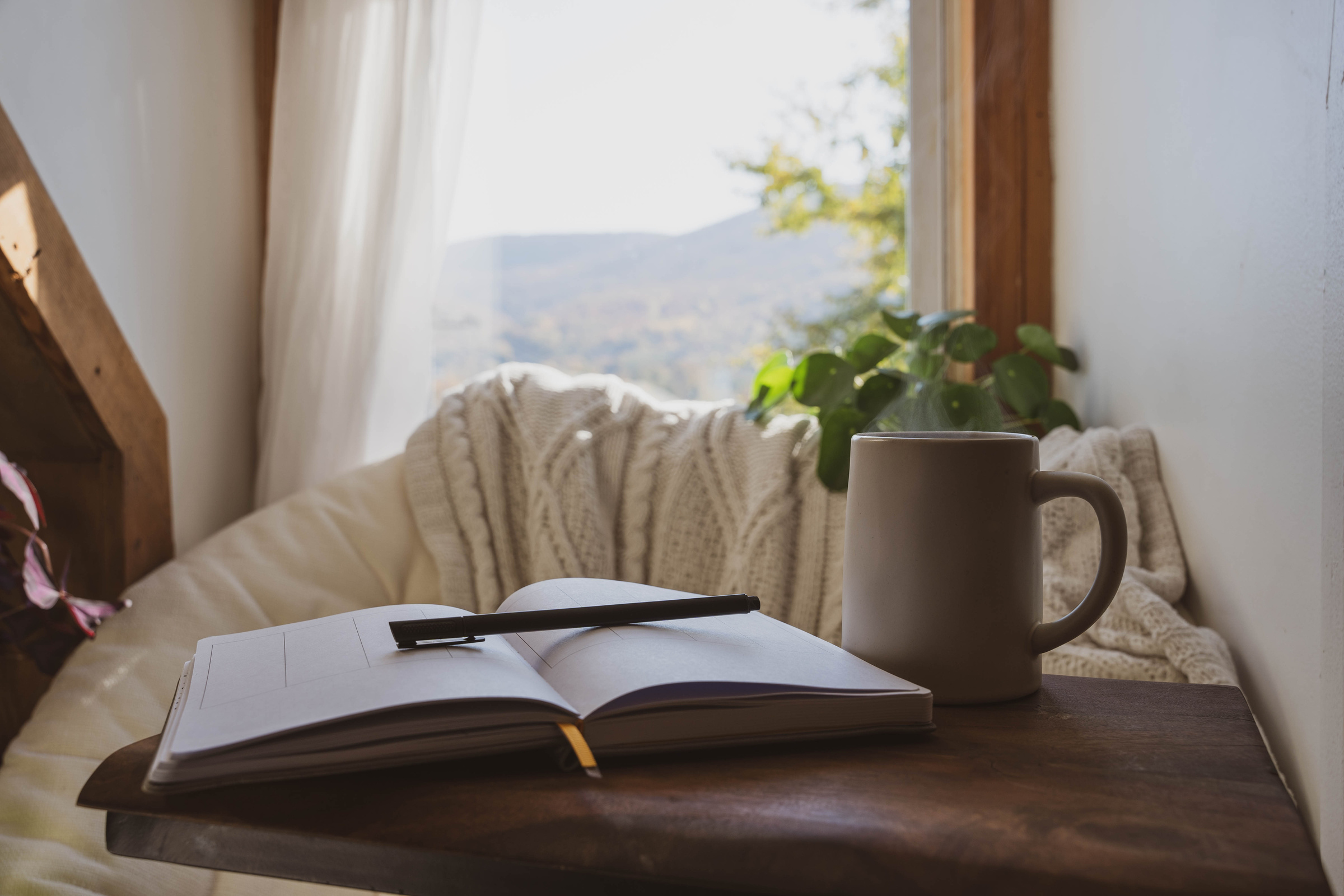 Cozy Window Nook with Open Journal And Coffee